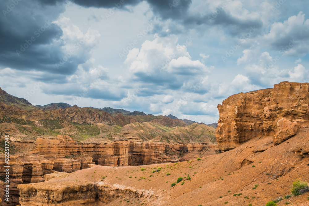 view of the canyon against a cloudy, stormy sky