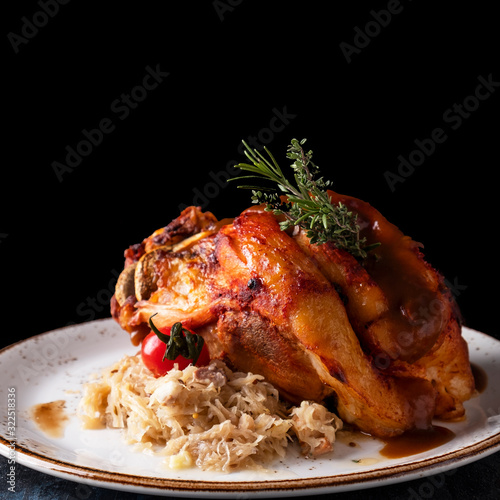 Photography Delicious roasted pork knuckle  with sauerkraut.