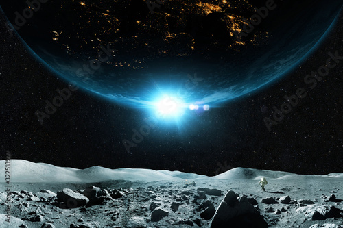 Fototapeta Naklejka Na Ścianę i Meble -  Spaceman walks on the moon against the background of the planet. Beautiful moon with planet Earth on a background of stars in outer space. Astronaut travels on an asteroid