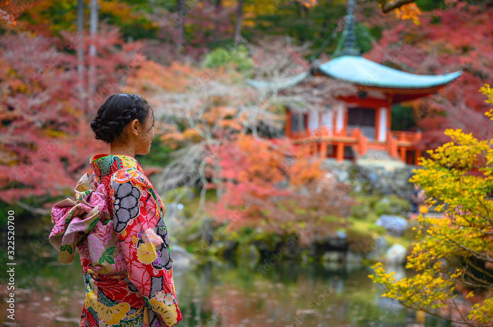 woman in old fashion style traditional of kimono, sstand alone in the middle of park of the village garden in autumn, travel and visit japan on incoming sport event woman in old fashion style traditional of kimono, sstand alone in the middle of park of the village garden in autumn, travel and visit japan on incoming sport event