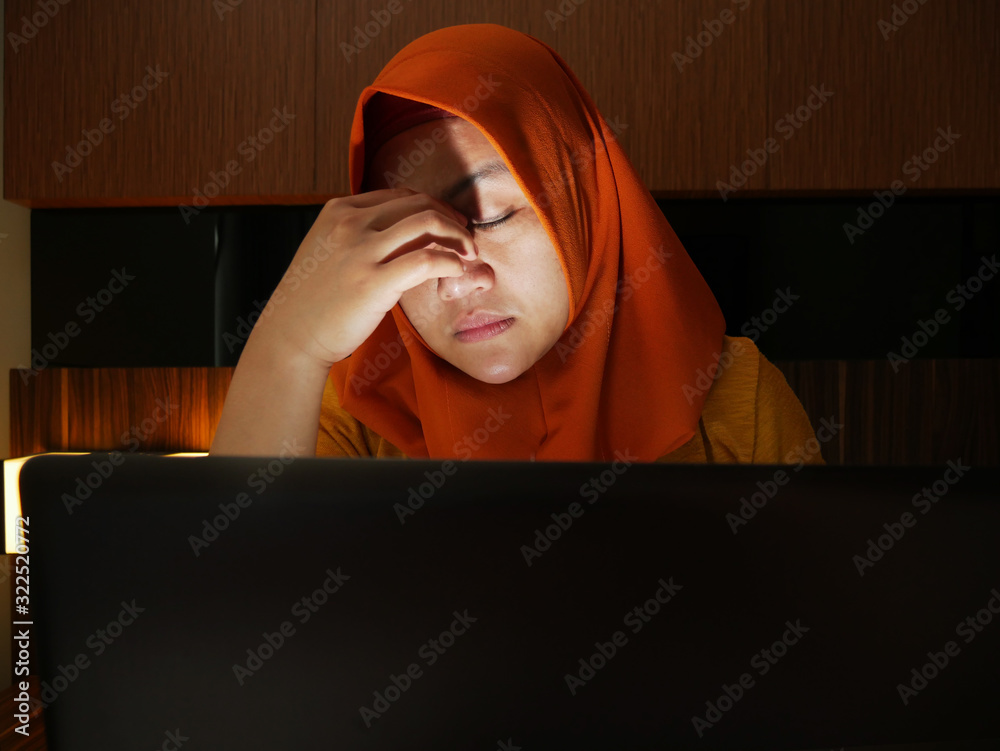 Sad Crying Muslim Businesswoman to See Bad Financial Loss Report on Laptop Sad Crying Muslim Businesswoman to See Bad Financial Loss Report on Laptop