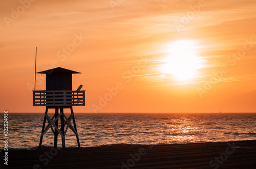 Landscape of a sunset in the beach. Orange sunset.