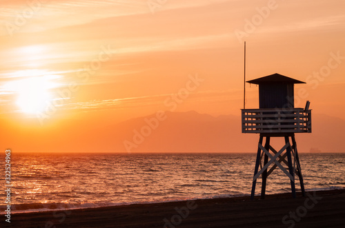 Landscape of a sunset in the beach. Orange sunset. © Elena Uve
