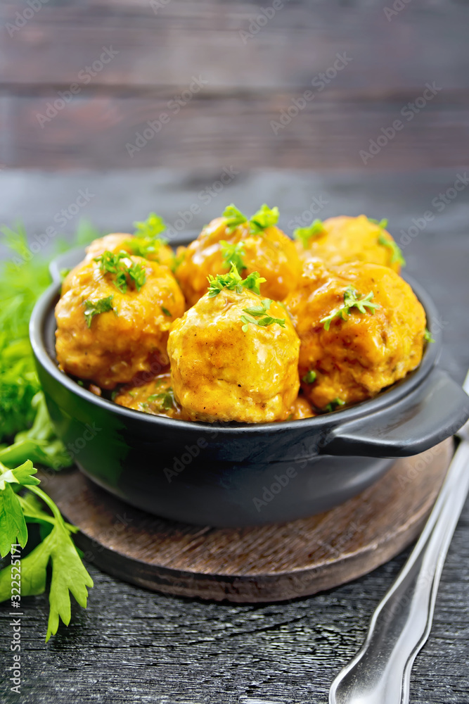 Meatballs in brazier with greens on board Meatballs in brazier with greens on board