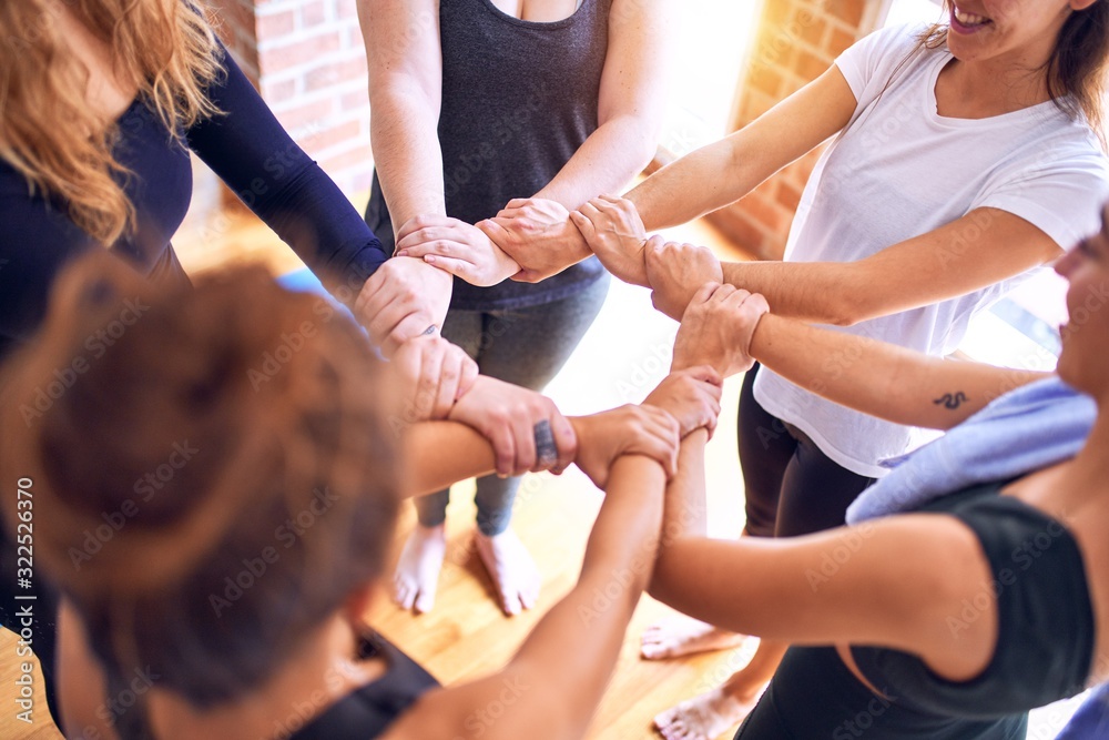 Young beautiful sportwomen doing gesture with hands Young beautiful sportwomen doing gesture with hands
