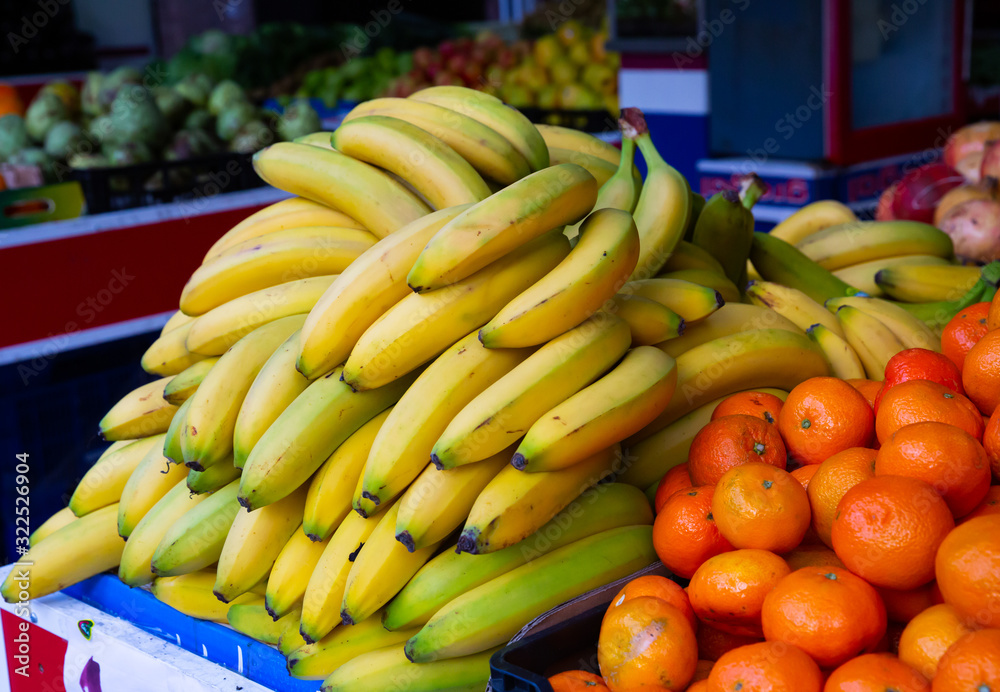 Fresh bananas on counter in food market