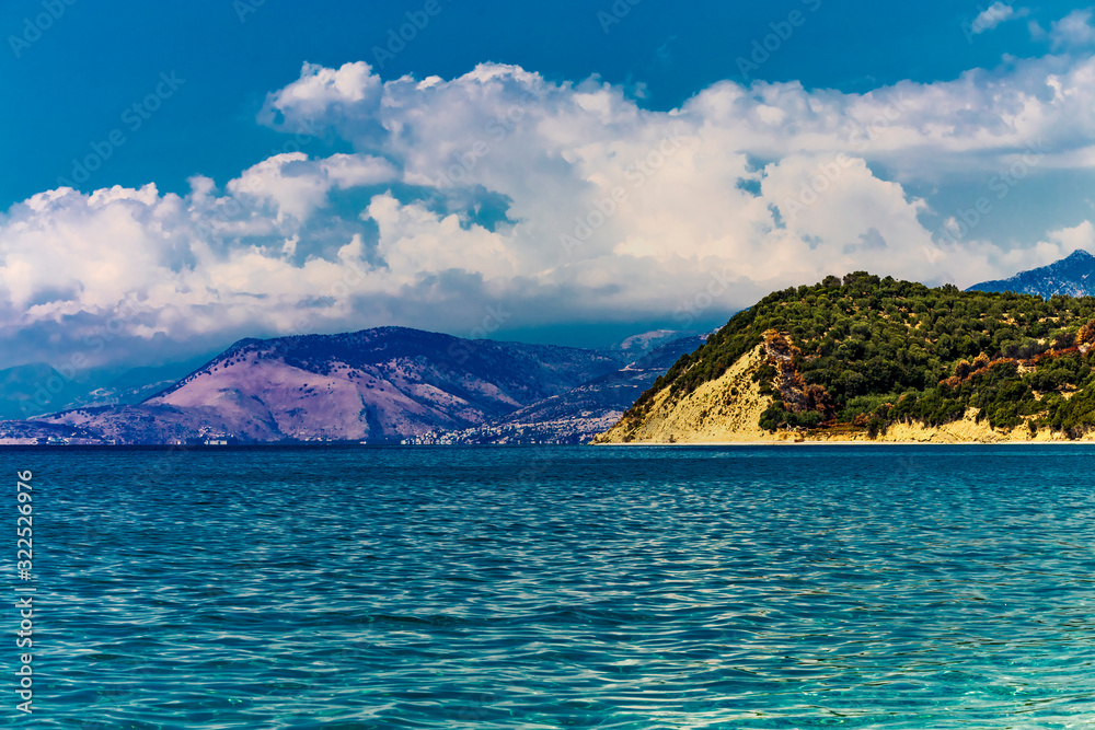Beautiful Ionian Sea with clear turquoise water and morning summer coast view from beach Lukove, southern Albania.