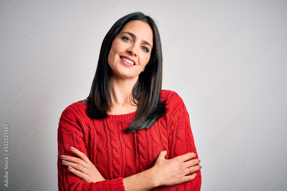 Young brunette woman with blue eyes wearing casual sweater over isolated white background happy face smiling with crossed arms looking at the camera. Positive person. Young brunette woman with blue eyes wearing casual sweater over isolated white background happy face smiling with crossed arms looking at the camera. Positive person.