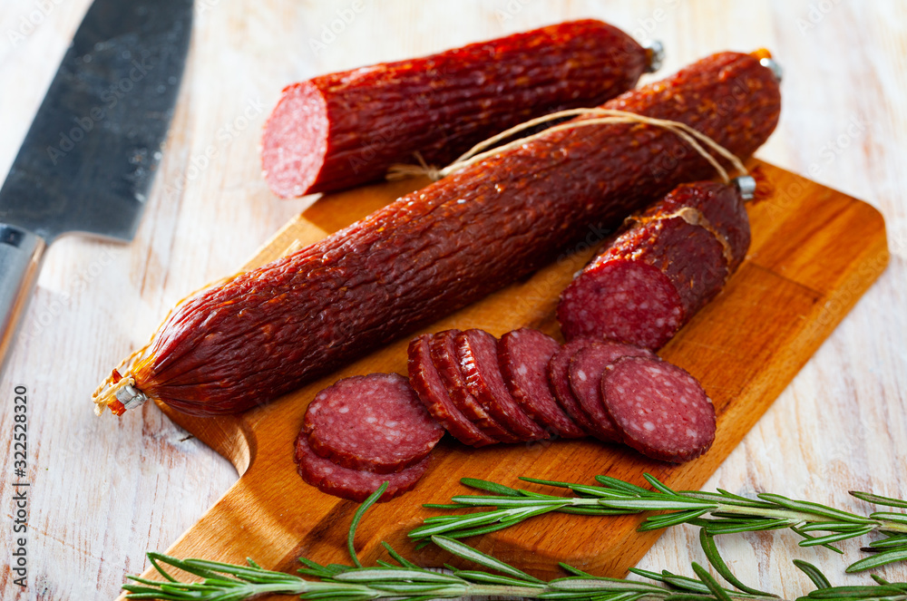 Russian raw smoked sausage with fresh herbs