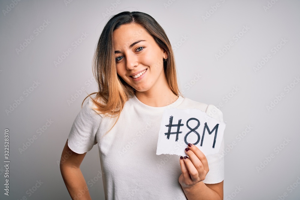 Beautiful woman with blue eyes celebrating 8th march womens day over white background with a happy face standing and smiling with a confident smile showing teeth Beautiful woman with blue eyes celebrating 8th march womens day over white background with a happy face standing and smiling with a confident smile showing teeth