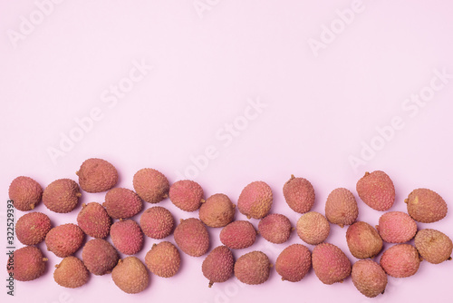 Flat Lay with Fresh and Tasty Lychee on Pink Background Top View Copy Space Organic Tasty Fruits