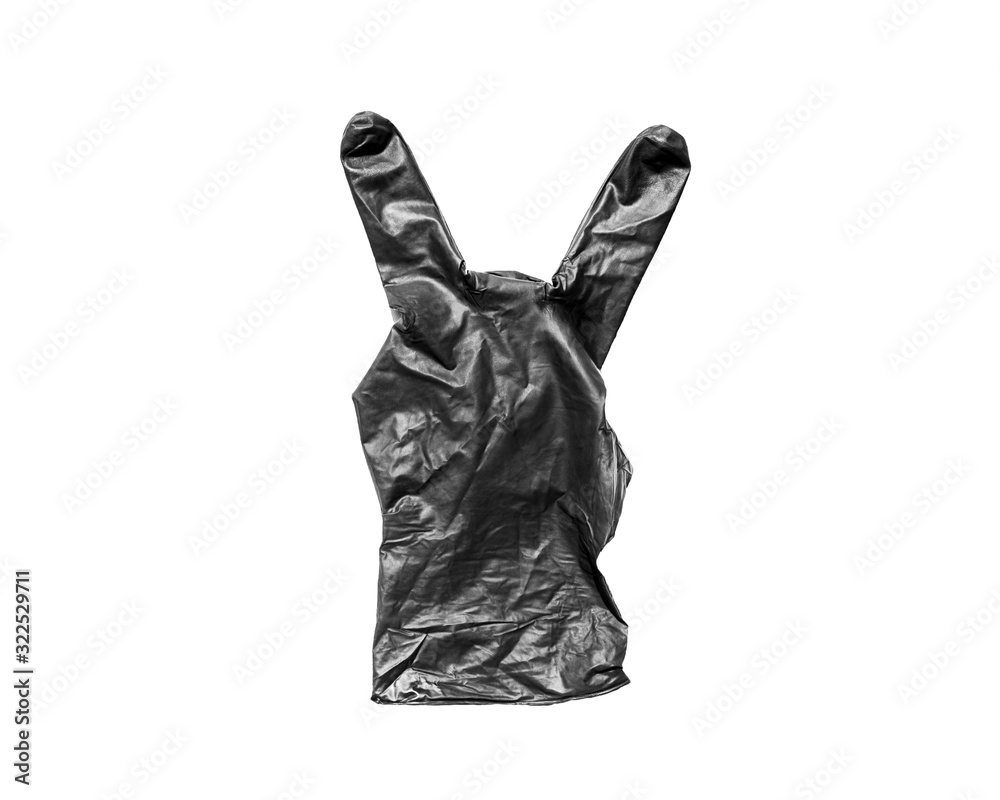Isolate black rubber glove showing two fingers on white background. Gesture that rocks or horns Isolate black rubber glove showing two fingers on white background. Gesture that rocks or horns