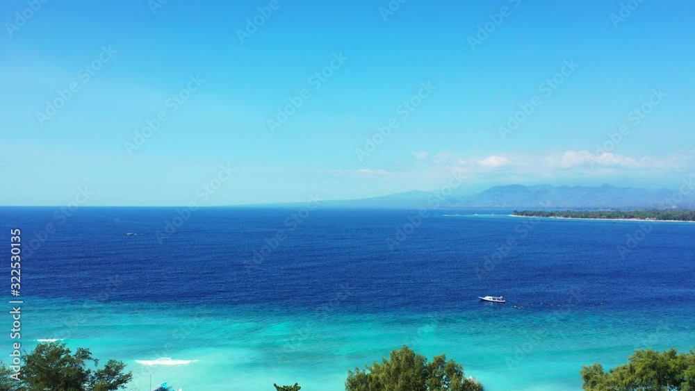 Beautiful colorful seascape with blue turquoise lagoon washing shore of tropical island with trees and lush vegetation in Thailand Beautiful colorful seascape with blue turquoise lagoon washing shore of tropical island with trees and lush vegetation in Thailand