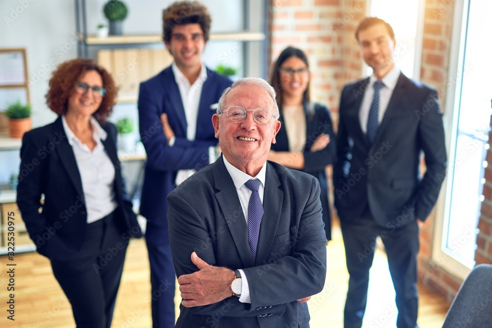 Group of business workers smiling happy and confident in a meeting. Standing with smile on face looking at camera at the office. Group of business workers smiling happy and confident in a meeting. Standing with smile on face looking at camera at the office.