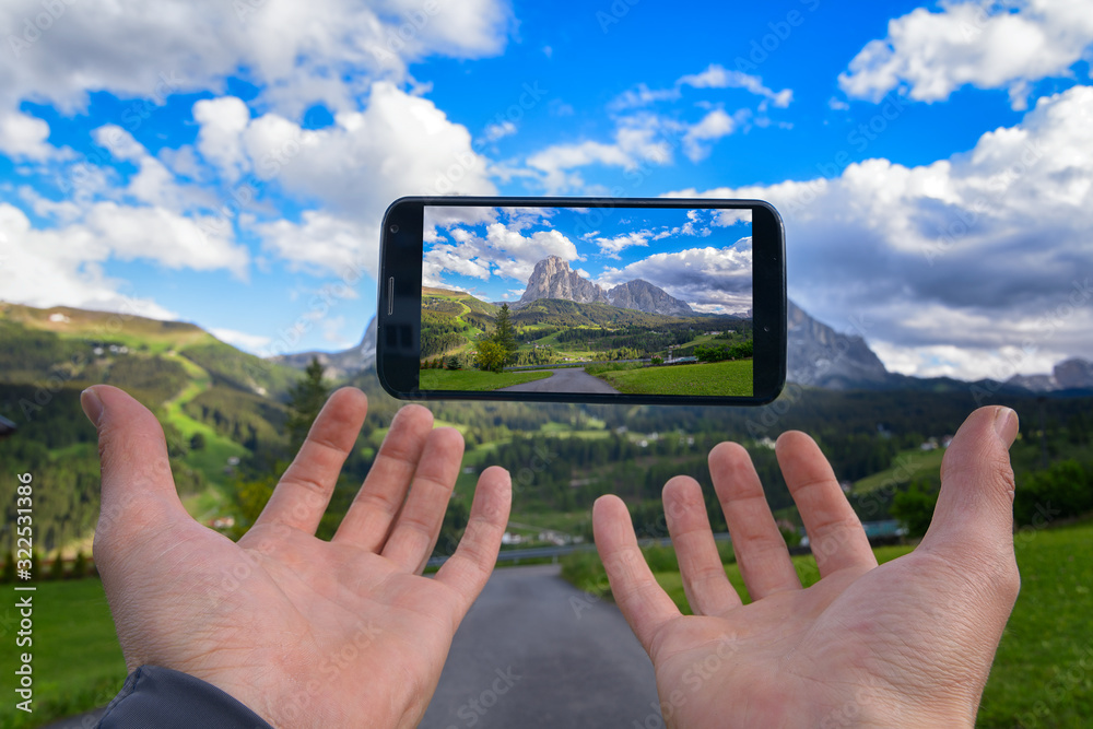 Hiking tourism with smartphone on the Val Gardena Dolomites Concept Adventure Outdoor in South Tyrol Summer vacation