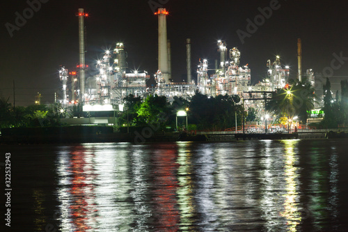 Oil refinery environmentally friendly, with sky and clouds, river © prasit