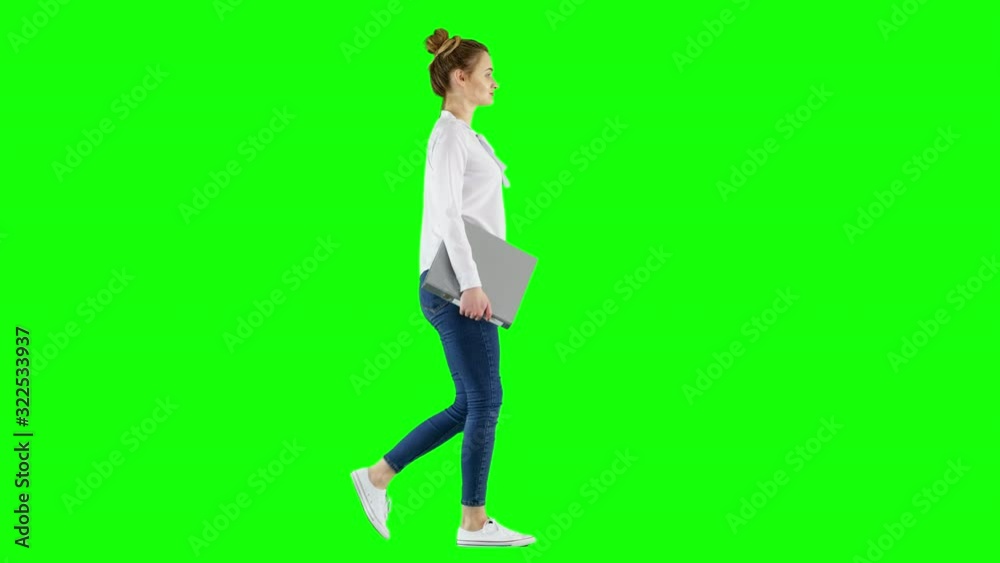 Young Female Manager Walking With a Binder Carrying Documents Green Screen