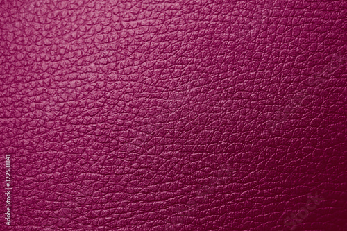 Texture of genuine leather maroon red magenta tone. Backdrop background textured effect for design. Artificial eco leather piece of artificial fake skin