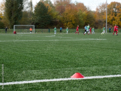 Selective focus to arker cones used for soccer training