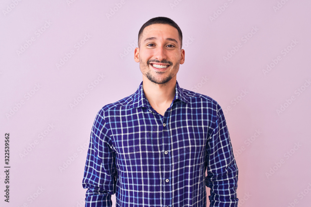 Young handsome man standing over isolated background with a happy and cool smile on face. Lucky person. Young handsome man standing over isolated background with a happy and cool smile on face. Lucky person.