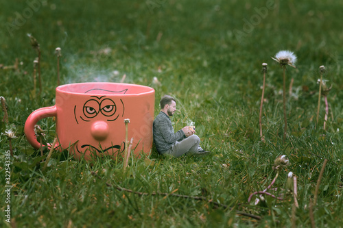 wait and drink tea, person sitting in front of a hot cup