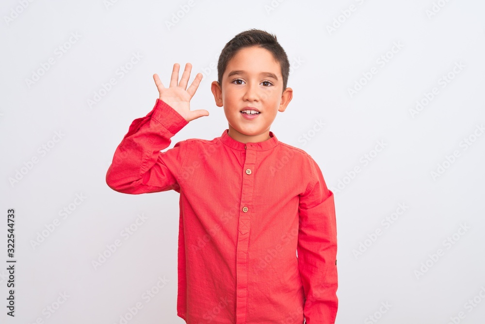 Beautiful kid boy wearing elegant red shirt standing over isolated white background showing and pointing up with fingers number five while smiling confident and happy. Beautiful kid boy wearing elegant red shirt standing over isolated white background showing and pointing up with fingers number five while smiling confident and happy.