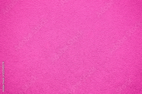 Pink painted wall. Old colored stone wall texture.