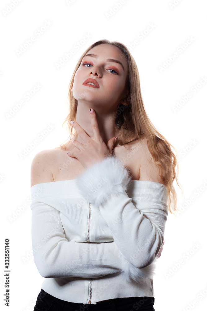 Portrait of beautiful blonde female model on white background.