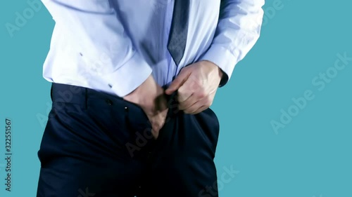 Overweight businessman trying to fasten too small clothes. Fat man with a big belly. Weight problems, diet, overweight, obesity concept