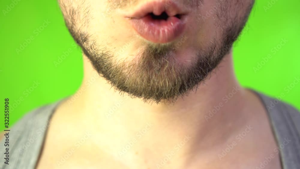 Male Mouth with Beard Bites a Bar of Chocolate. Chocolate and Sweet tooth concept. Man Sweet Tooth Loves Chocolate. Male Mouth with Beard Bites a Bar of Chocolate. Chocolate and Sweet tooth concept. Man Sweet Tooth Loves Chocolate.