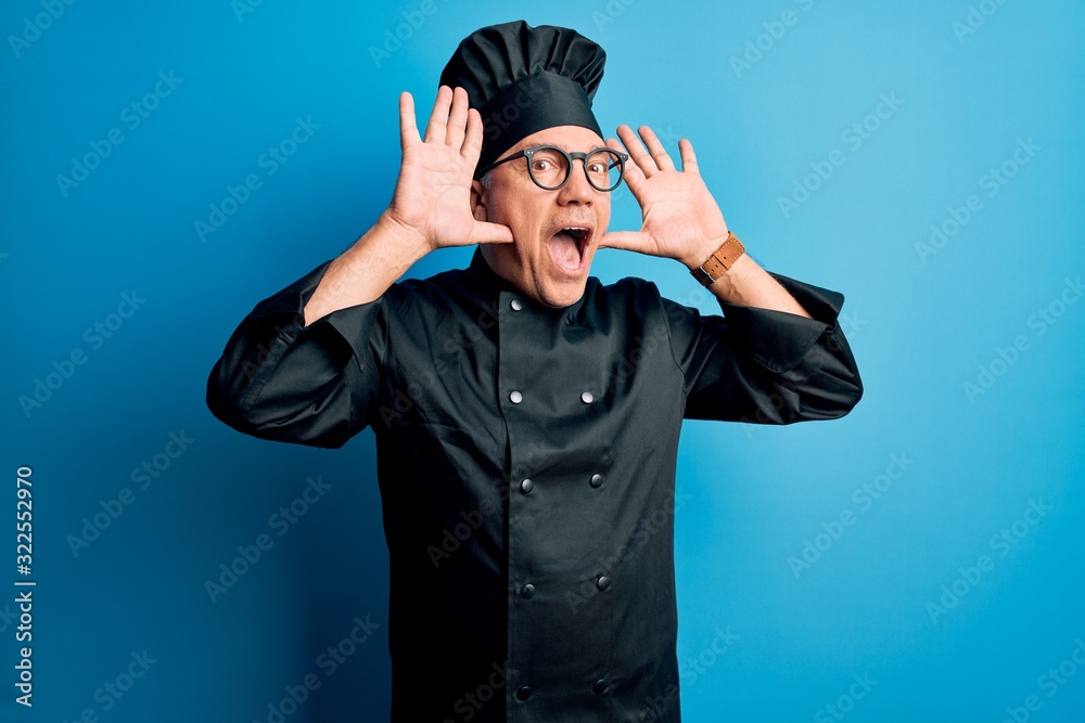 Middle age handsome grey-haired chef man wearing cooker uniform and hat Smiling cheerful playing peek a boo with hands showing face. Surprised and exited Middle age handsome grey-haired chef man wearing cooker uniform and hat Smiling cheerful playing peek a boo with hands showing face. Surprised and exited