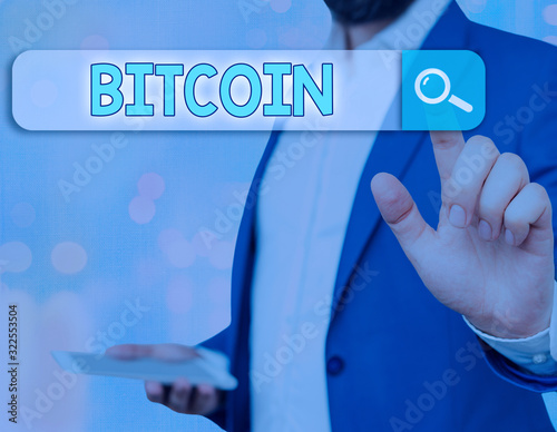 Writing note showing Bitcoin. Business concept for Cryptocurrency Blockchain Digital currency Tradeable token photo