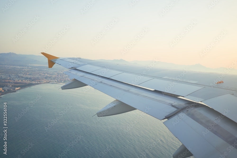 Obraz premium Cloudscape from window airplane, landscape of wing plane on a cloudy sky