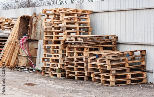 many old wooden pallets on the street photo