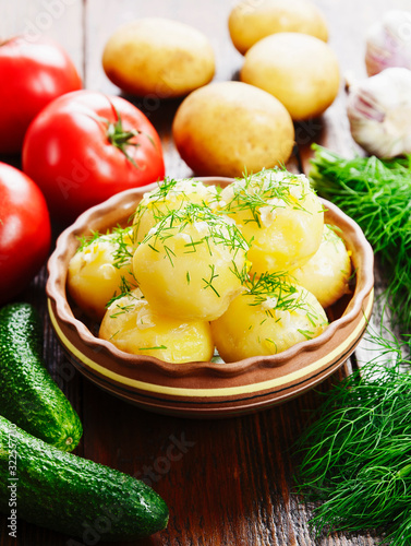 Boiled potatoes with dill photo