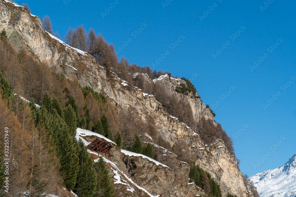 Panoramic view on winter snowy mountains at nice sunny evening.
