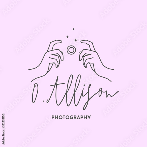 Linear logo of the photographer. Women's Hands hold the camera shutter. Vector logol for a photo Studio