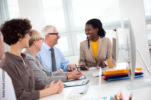 Multy-ethnic group of business people working with computer at office