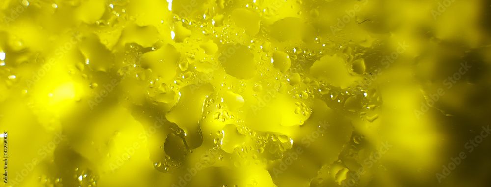 water drops on a yellow background. Abstract yellow background. Water drops on glass. banner - obrazy, fototapety, plakaty 