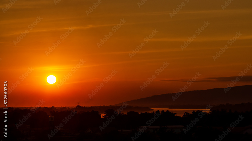 Obraz premium Scenic View Of Silhouette Landscape Against Orange Sky During Sunset