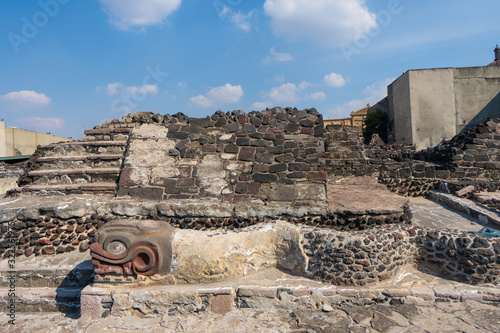 Fragment of Greater Temple (Templo Mayor) with Kukulkan (Feathered Serpent) head. Detail of ancient aztec ruins. Travel photo. Mexico city. photo