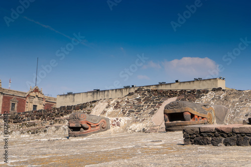 Fragment of Greater Temple (Templo Mayor) with Kukulkan (Feathered Serpent) head. Detail of ancient aztec ruins. Travel photo. Mexico city. photo