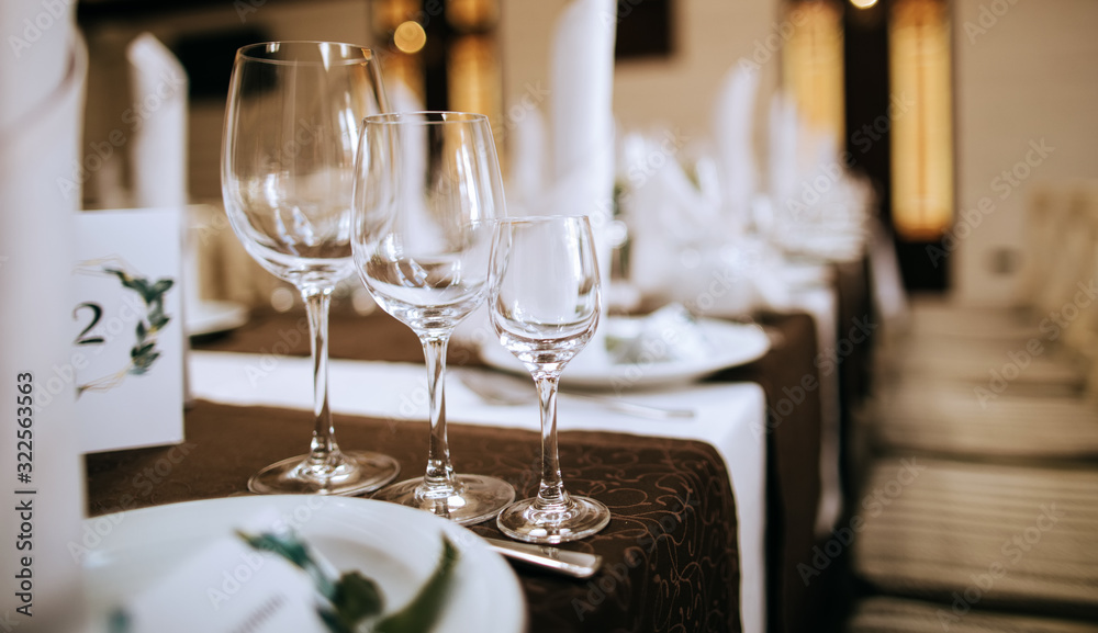 Elegant table setting with wine glasses and plates. Catering Elegant table setting with wine glasses and plates. Catering