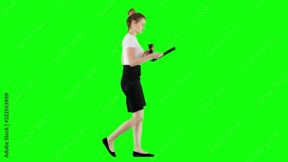 Confident Business Girl Checks Her Notes While Drinking Coffee Green Screen Confident Business Girl Checks Her Notes While Drinking Coffee Green Screen