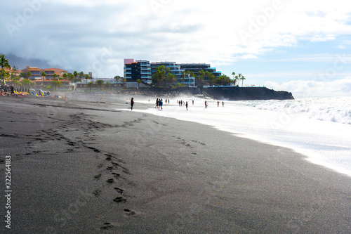 Black lava sand beach in Puerto Naos, La Palma, Canarian islands, Spain photo