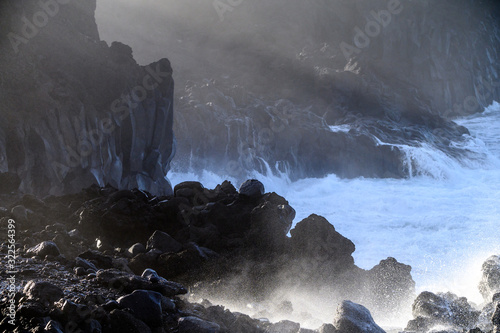 Dangerious ocean stormy waves hits black lava rocks on La Palma island, Canary, Spain