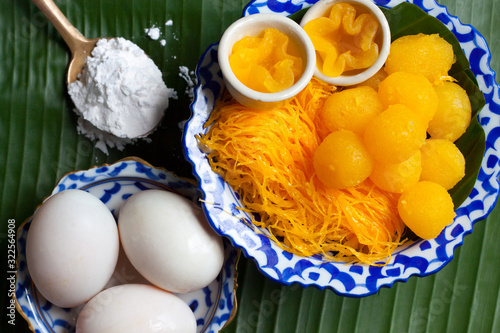 Thai dessert culture are traditional kanhom of Thailand.Thai desserts are made from duck eggs mixed with flour and sugar. Arrange with the banana leaves with beautiful. photo