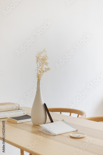 white vase on wood table bright cozy interior