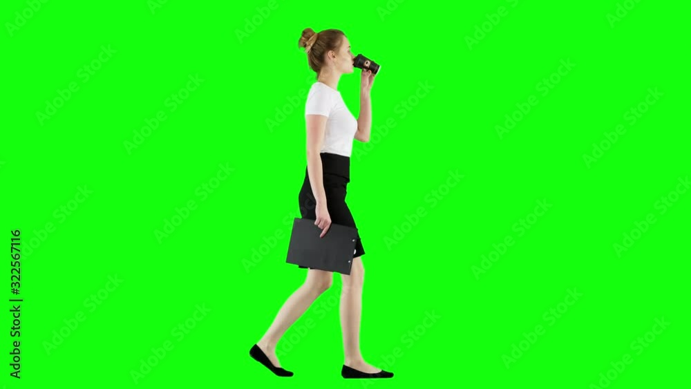 Brunette Businesswoman Drinking Coffee While Walking With Clipboard Green Screen Brunette Businesswoman Drinking Coffee While Walking With Clipboard Green Screen