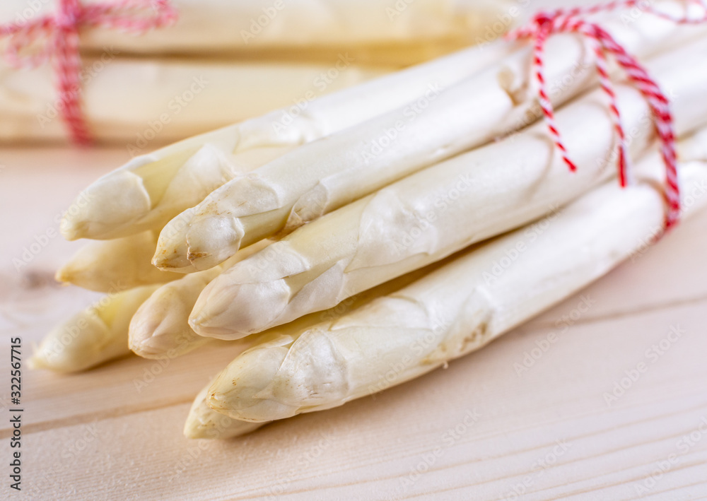 New harvest of white asparagus, two bunches high quality raw asparagus in spring season, ready to cook New harvest of white asparagus, two bunches high quality raw asparagus in spring season, ready to cook